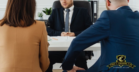 divorcing couple talking to a lawyer