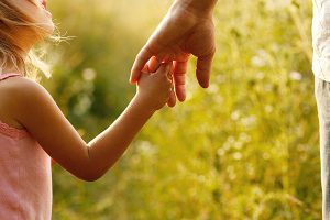 hand holding family